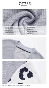 Detail showing grey waffle knit fabric with leopard print patchwork on long sleeves