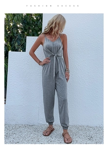 Detailed view of grey casual jumpsuit featuring a front waist knot and elastic tapered cuffs