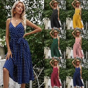 Women's V-neck polka dot midi dress with spaghetti straps and waist tie in summer garden