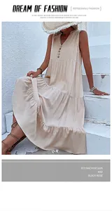 Detail of a tiered beige maxi dress with V-neckline and decorative front buttons