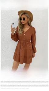 Detailed close-up of a caramel V-neck long-sleeve dress with elastic drawstring waist