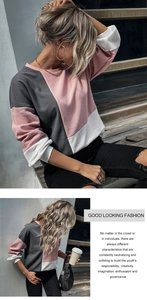 Close-up of pink and grey waffle knit fabric texture and color-blocked crewneck detail