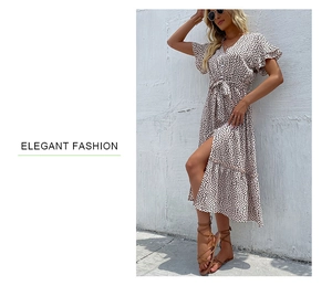 Close-up of V-neck summer floral dress featuring side slit and elegant tie-waist detail