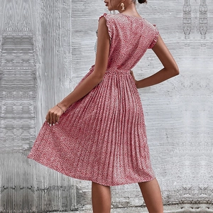 Sleeveless green floral pleated dress with waist tie and ruffle details for summer wear
