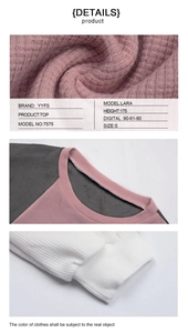 Detail of pink waffle knit fabric with grey contrast collar and ribbed white cuffs
