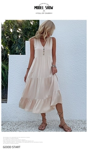Close-up of beige V-neck sleeveless maxi dress featuring buttoned front and tiered skirt