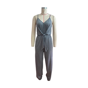 Detail showing the gray jumpsuit waist tie and soft knit fabric texture on mannequin