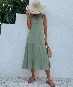 Detail of sage green V-neck sleeveless midi dress with vintage buttons and tiered skirt