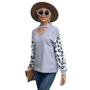 Women's autumn knit top with leopard print sleeves and cutout V-neck design