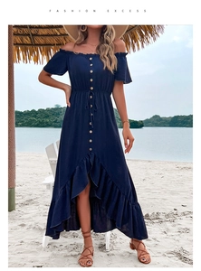 Detail of navy off-shoulder dress featuring ruffle sleeves and wooden button decorations