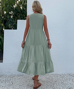Back view of sage green sleeveless tiered maxi dress with layered ruffle hem details