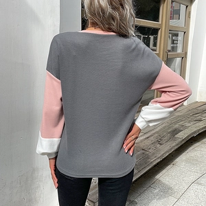 Women's color block waffle knit sweater in grey pink and white featuring long sleeves