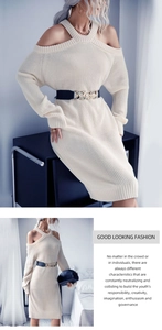 Detail of off-white off-shoulder knit dress with elegant halter neck and gold chain belt