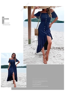 Close-up of the wooden button details and ruffle asymmetric hem on the navy summer dress