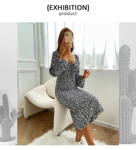 Close-up of floral print long sleeve V-neck dress with elegant necktie details