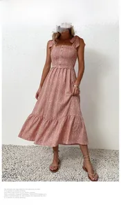 Detail of floral off-shoulder maxi dress with shirred bodice and bow shoulder straps