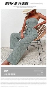 Detail of vintage green floral strapless wide-leg jumpsuit with waist tie and buttons