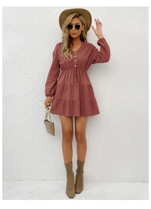 Detail showing V-neck button closure and drawstring waist on the mauve midi dress