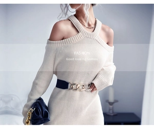 Detail view of off-white knit dress with cold-shoulder design and textured fabric