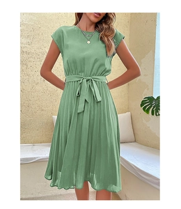 Detail of sage green pleated midi dress with round neck and tie-waist ribbon design