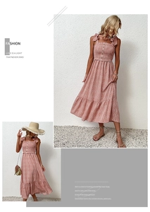 Detail of pink floral midi dress featuring smocked bodice and bow shoulder straps