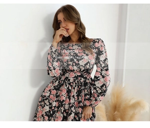 Detail view of the floral print pattern and elastic waist on long sleeve maxi dress