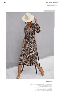 Detail of V-neck leopard print midi dress with ruffled hem and long lantern sleeves