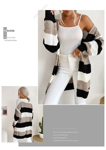 Close-up of color-block knit cardigan with thick stripe pattern and ribbed texture details