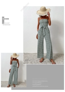 Close-up of floral bandeau jumpsuit with button detail and waist tie for summer style