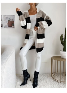 Detail of long-line striped knit cardigan with chic color-block design in neutral tones