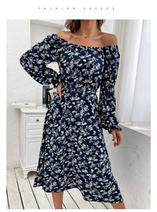 Detail of vintage navy blue floral dress with off-shoulder neckline and long puff sleeves