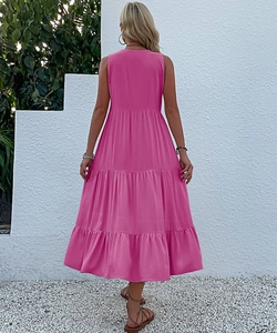 Detail view of the tiered magenta long summer dress showing layered ruffles and back profile
