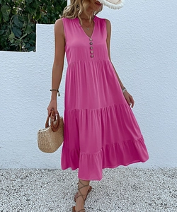 Detail of fuchsia V-neck sleeveless tiered maxi dress with button-front design