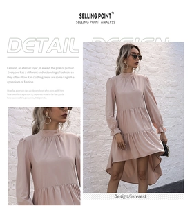 Detail of light pink tiered cake dress featuring ruffled cuffs and irregular fish tail hem