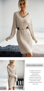 Detail of beige V-neck knitted dress with black lace trim and golden chain belt