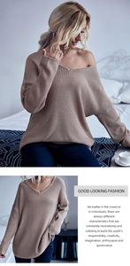 Detail shot of a beige waffle-knit texture on a cozy V-neck oversized sweater