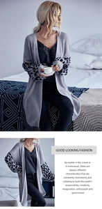 Detailed knit texture of light grey cardigan with leopard print sleeves and ribbed cuffs
