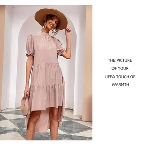 Detail view of pink puff sleeve tiered dress with high-low hem and stand collar
