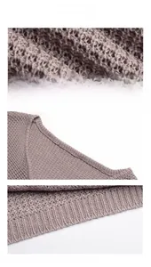 Detail of dusty mauve waffle knit sweater showing ribbed cuffs and hollow weave texture