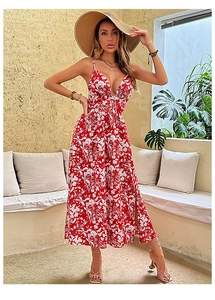 Detail of red floral maxi dress featuring a V-neck, thin straps and side slit for summer