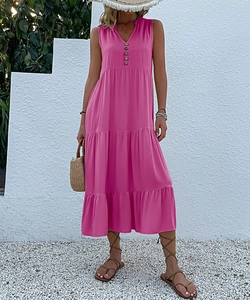 Detail of V-neckline and tiered ruffle skirt on a summer sleeveless maxi dress
