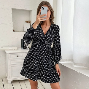 French style black and white polka dot wrap dress with long sleeves and V-neckline