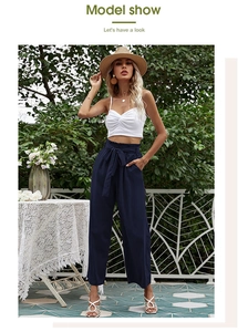 Détail du pantalon bleu marine à taille haute et jambe large avec nœud pour les vacances