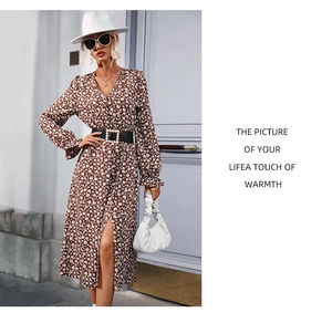 Detail of floral V-neck dress featuring a stylish black belt with a pearl buckle