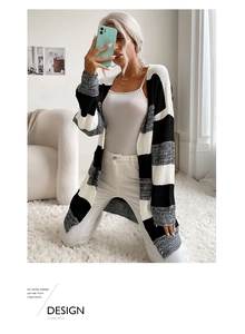 Detailed knit texture of a black and white striped long sleeve open front cardigan