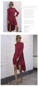 Detail of burgundy high-low dress featuring layered ruffles and elegant flare sleeves
