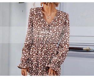 Detail of V-neck floral midi dress featuring button decor and elastic high waist design
