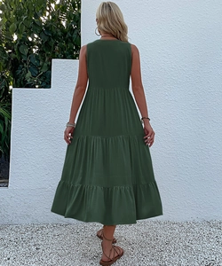 Detail view of tiered boho maxi dress in dark green featuring sleeveless design
