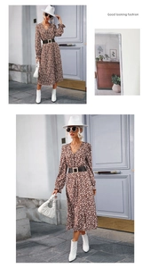 Detail of a brown floral V-neck midi dress with long sleeves and a pearl buckle waist belt