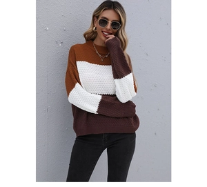 Detailed close-up of a three-tone color block knitted sweater with ribbed cuffs and texture